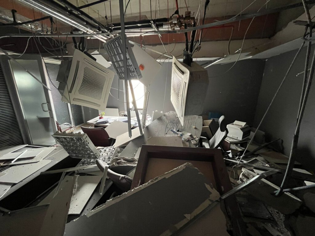 Damaged interior of a grey room in the building of Antakya Chamber of Industry and Commerce after the earthquake