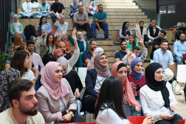Palestinian youth learning tech skills and networking in community event