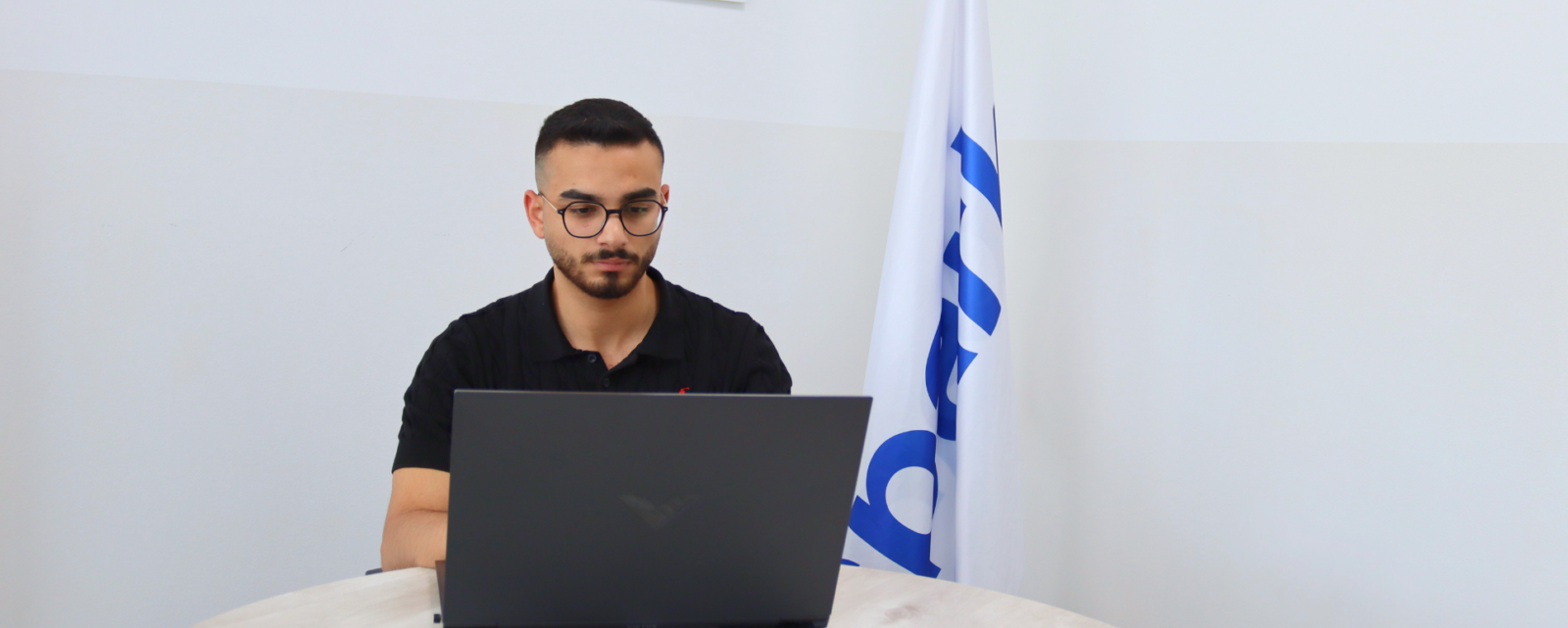 young man working on a laptop